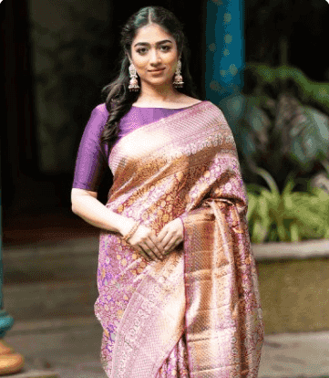 Model in a pink and gold brocade saree