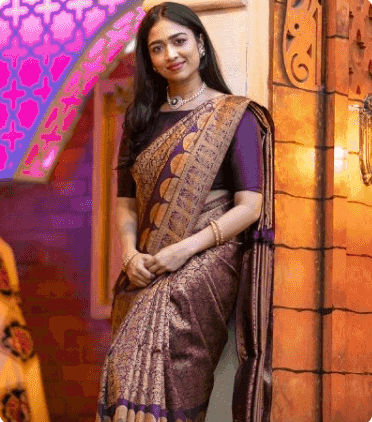 Model in a purple and gold silk saree