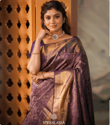 Model in a violet zari Kanjivaram saree